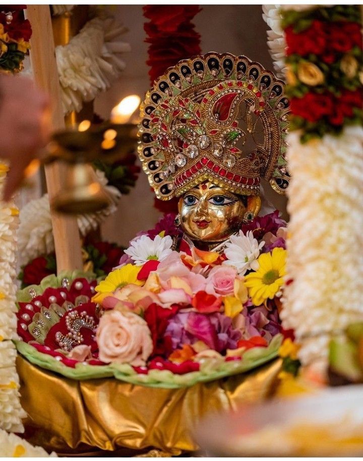 Beautifully decorated altar with Lord Krishna idol for Krishna Janmashtami celebration.