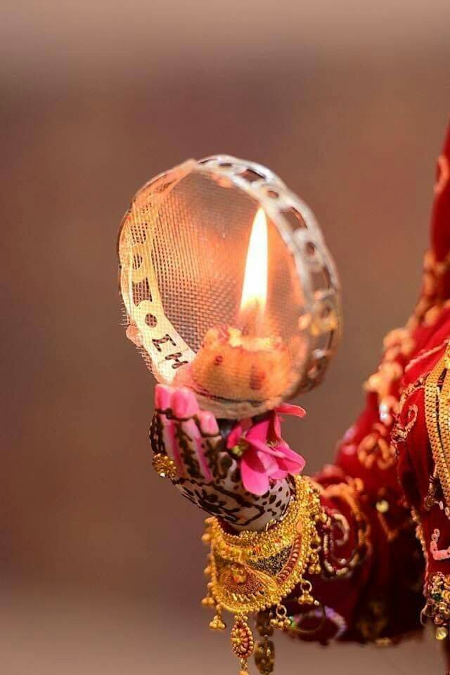 Karwa Chauth 2024 celebrations with fasting women, rituals, and moon sighting.